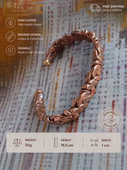 A copper braided cuff bracelet displayed on a textured newspaper background, with informational text overlays detailing its features (pure copper, braided design, durable) and physical measurements (weight 50g, height 19.5 cm, width 1 cm).